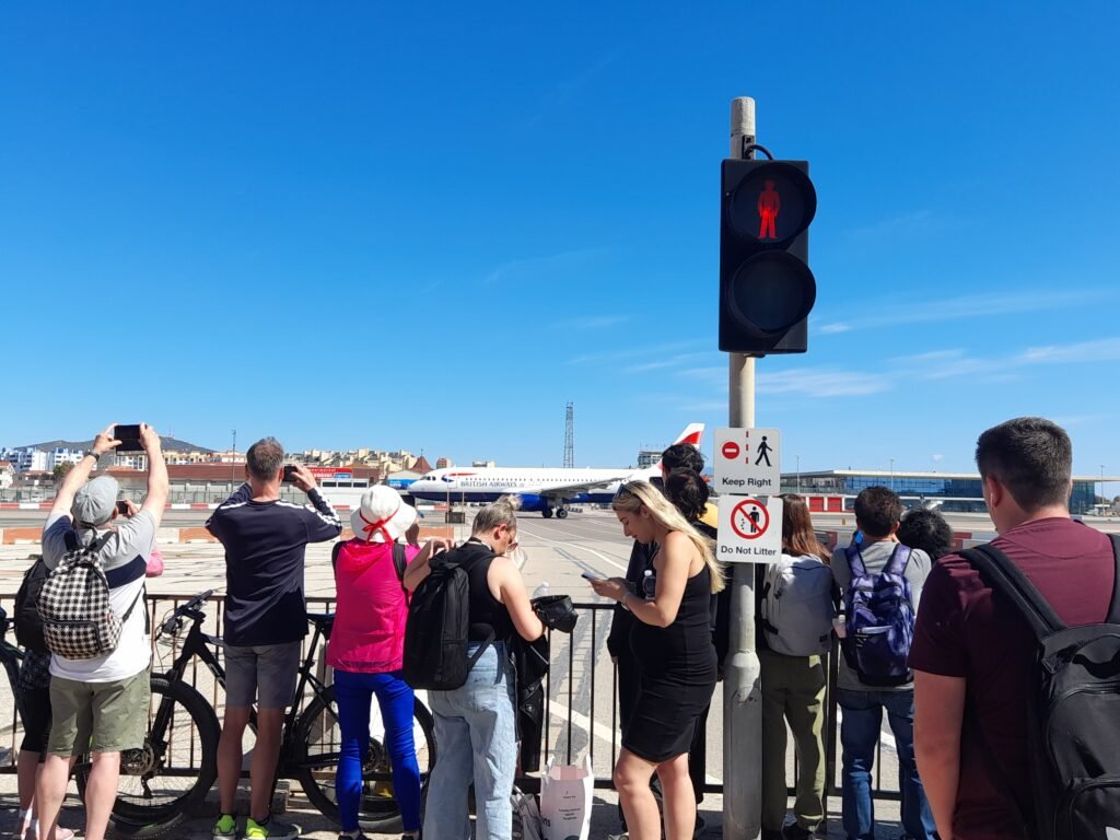 Queuing at the runway to let a plane go by!