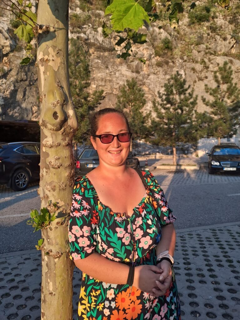 A casual, golden hour photo of me at Ostrog Monastery, taken by a very kind fellow solo female traveller.