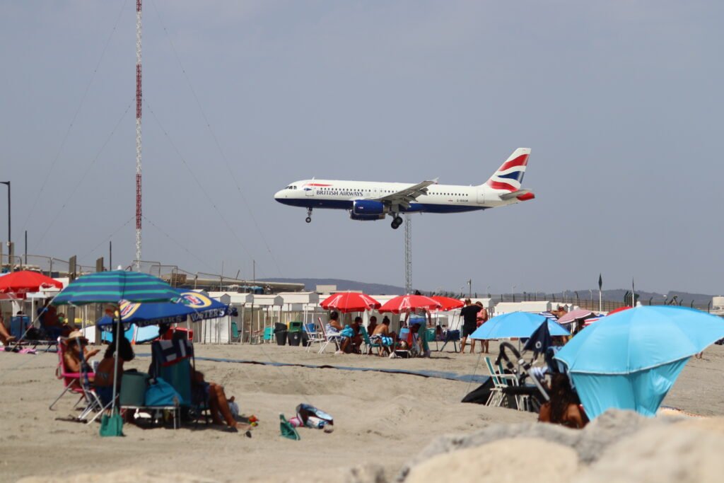 Watching planes land while sunbathing on Eastern Beach!