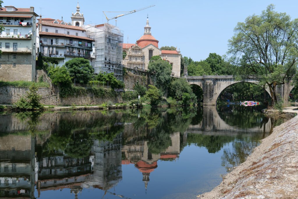 Amarante's beautiful church and bridge, by the Tamega river! Amarante is one of the best places to visit in Portugal for first-timers!