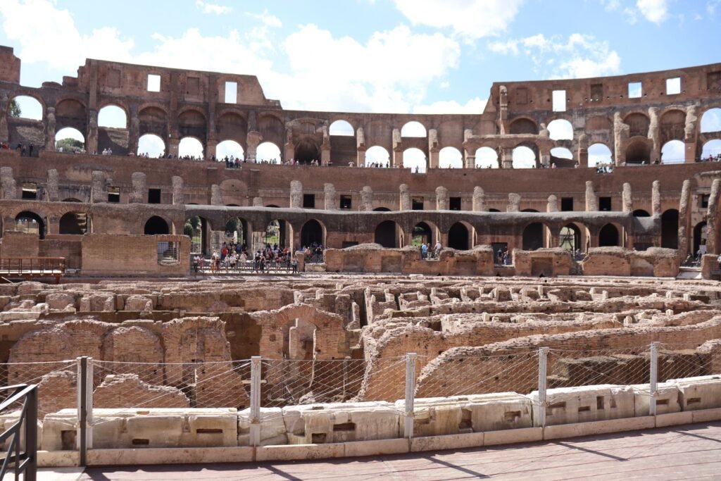 Admiring the true scale of the Colosseum from the Arena Floor! (It's well worth the extra cost!)