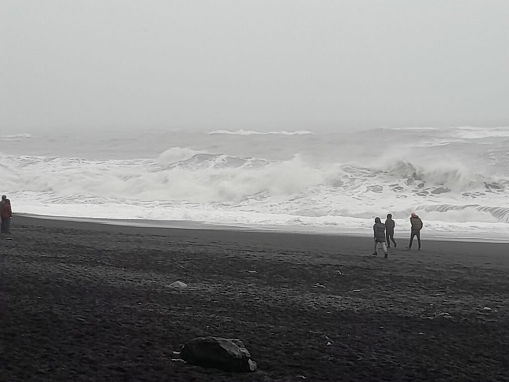 Visiting Reynisfjara beach with its infamous sneaker waves (please don't be like these people)