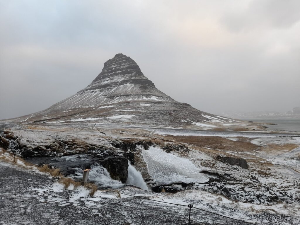 The famous mountain of Kirkjufell in winter, with the sun just trying to break through!