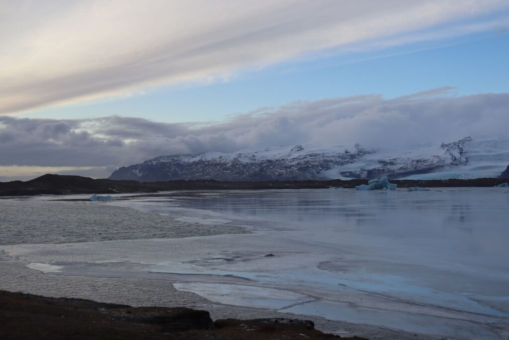 Walking the shore of the glacier lagoon in the stunning winter light!