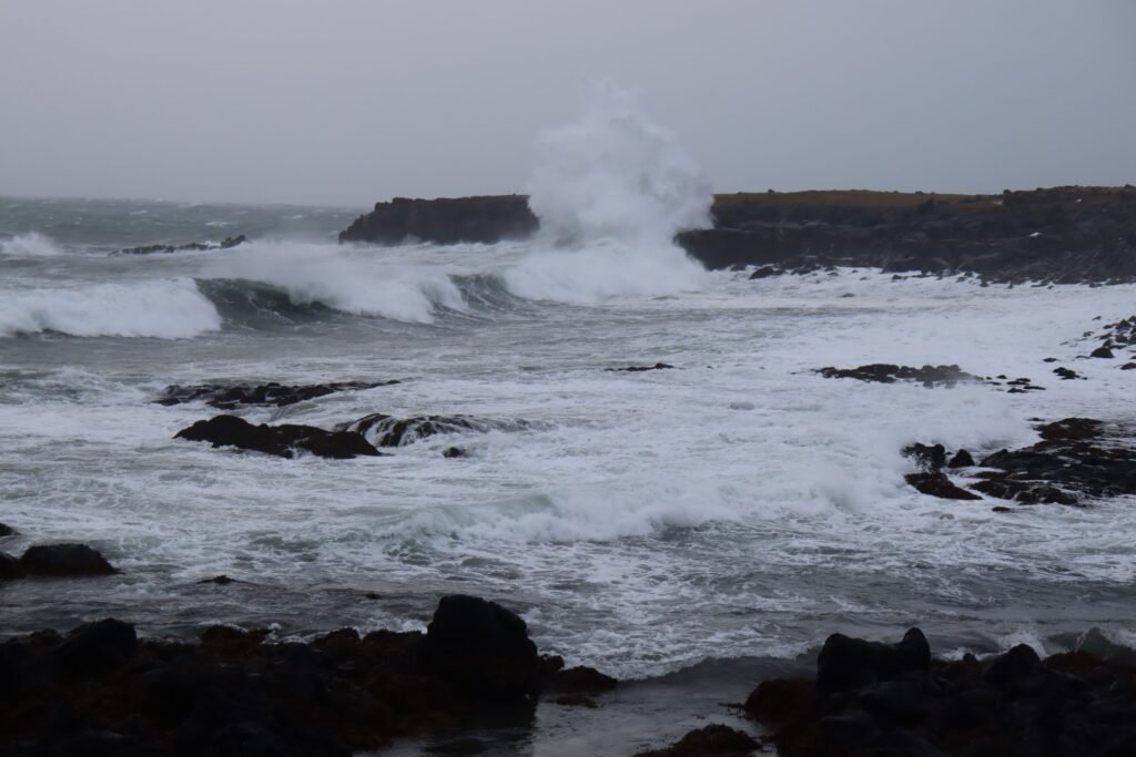 Waves crashing against the Arnarstapi Coastline