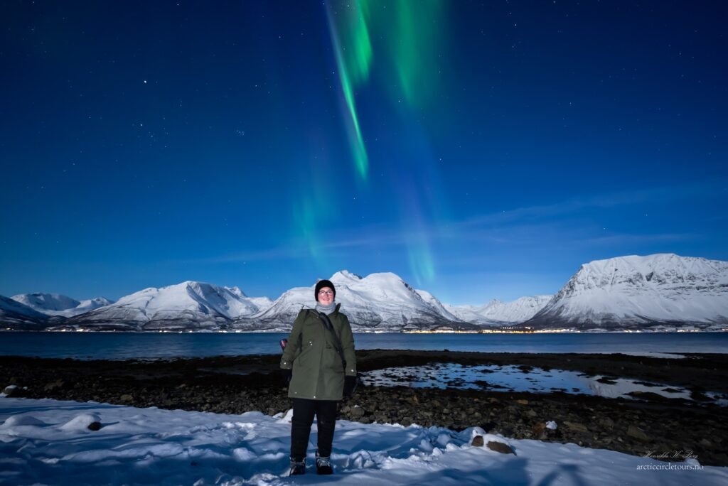 A pro photo of me under the Northern Lights, taken on my Arctic Tours Northern Lights Hunt