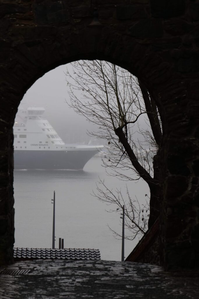 A ship floating past the cobbled archways of Akershus Fortress in Oslo!