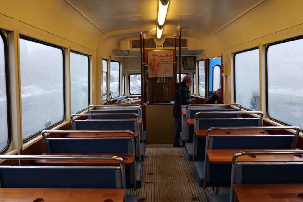 Taking a ride on a vintage tram, on an excursion with Havila