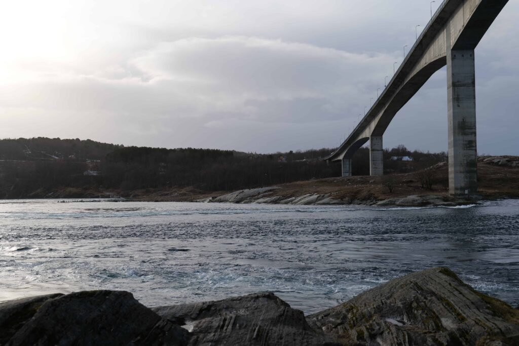 The current from the water, looking up at the bridge