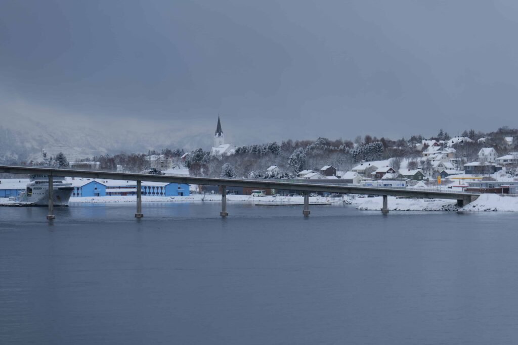 Approaching Sortland's blue buildings and beautiful white church on the hill