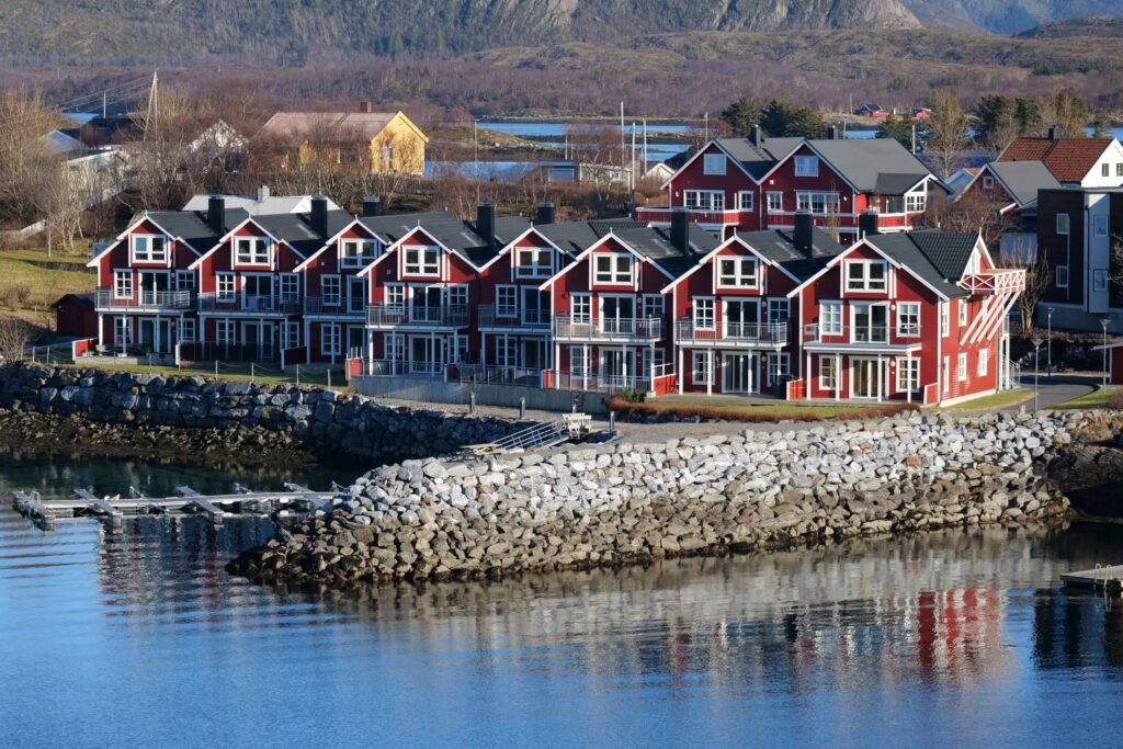 Quaint red buildings lining the underrated waterfront in Brønnøysund 