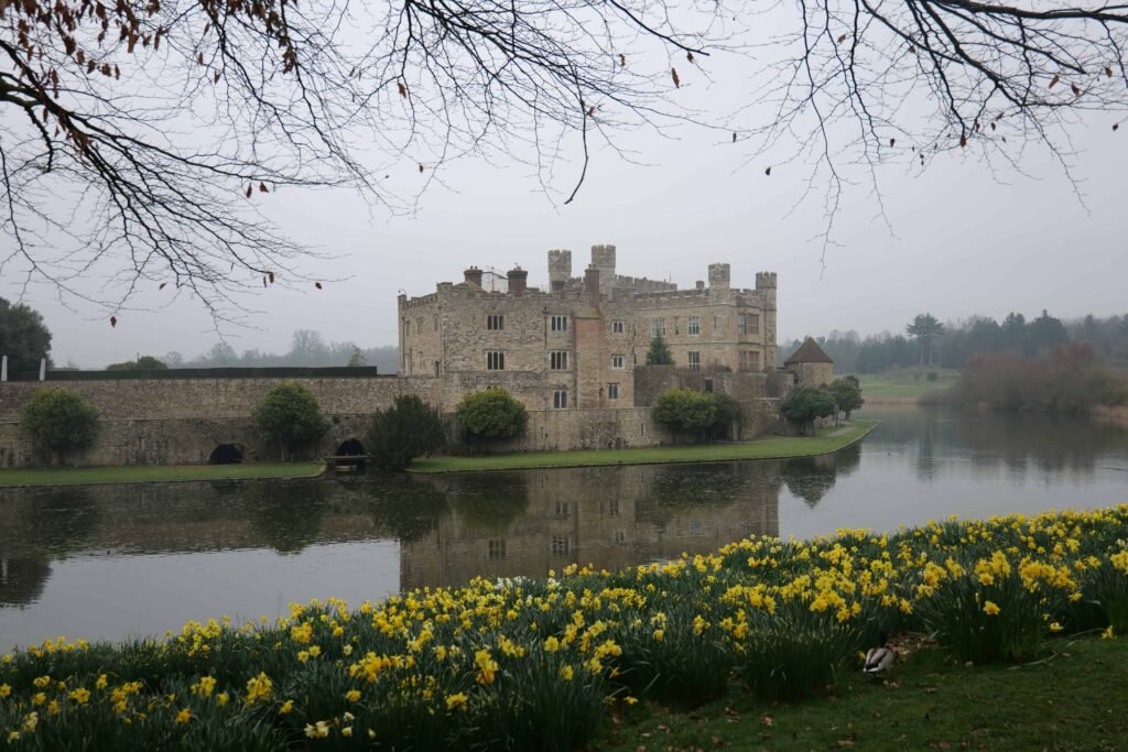 A wider angle view of the misty moat surrounding Leeds Castle