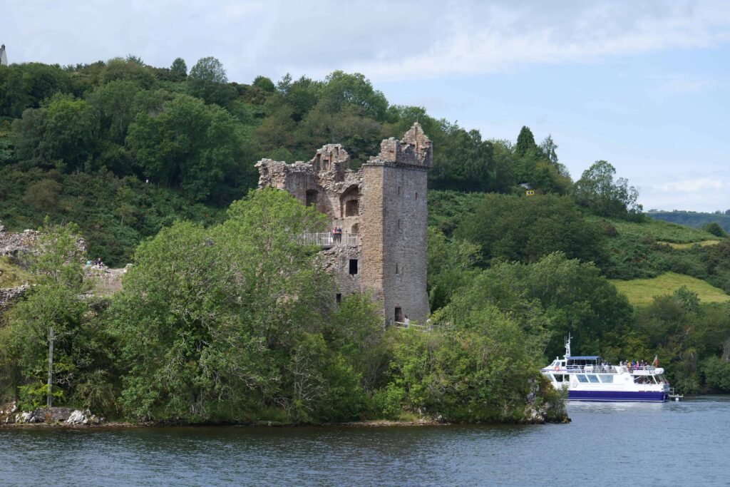 Boats docked at Urquhart Castle in summer